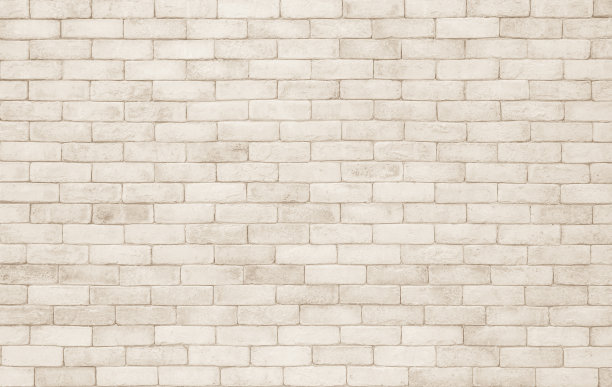 乳白色砖墙纹理背景。砖和石材地板背景室内设计家居风格复古旧模式清洁与混凝土颜色不均的米色砖堆叠装饰。图片下载