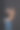 一位身穿黑色连衣裙的母亲抱着她的儿子，坐在一张高椅子上。图片下载