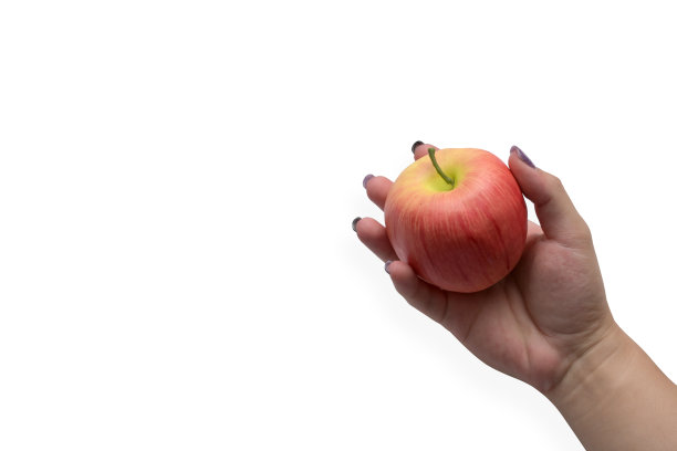 手持新鲜的红苹果孤立在白色背景与复制空间。图片下载