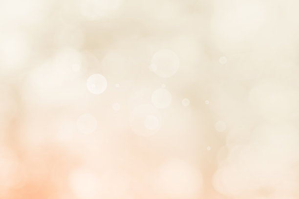 摘要模糊的奶油色为背景，模糊的节日灯光为室外庆祝活动和白色散景聚焦纹理装饰设计优雅的赢家。图片下载
