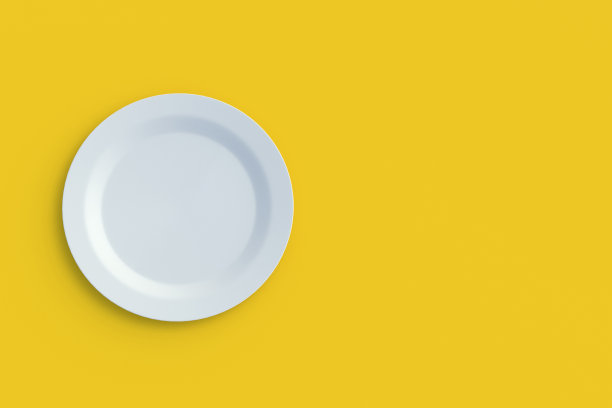 黄色背景的圆形盘子。前视图。副本的空间。三维渲染图片下载