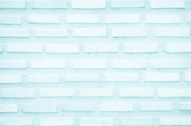 砖墙漆成淡蓝色，底色柔和柔和，纹理柔和。砌砖和石材地板内部岩石旧模式干净的混凝土网格不均匀的砖设计堆叠背景。图片下载