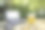 咖啡杯纸和笔记本电脑在绿色的自然背景。远程或在家工作。软的焦点。浅聚焦效果。图片下载