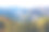 山间的美景如画。令人惊叹的山脉山谷风景景观之间的云和古色古香的森林丘陵。山间秋色摄影素材图片下载