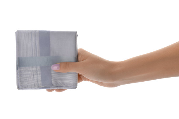 女人拿着手帕孤立在白色，特写图片下载