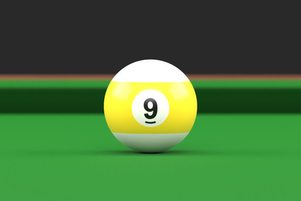 黄白相间的九号台球放在台球桌上图片下载