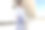 拿着滑板站在办公楼旁边的黑人男工人。图片下载