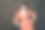满意的女孩在眼镜孤立在黑色背景上的橙色连衣裙图片下载