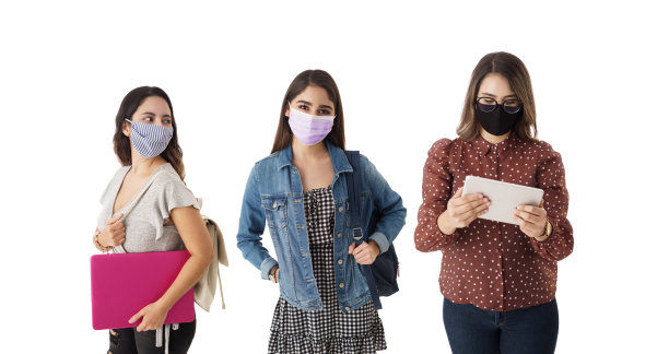 三个女学生带着面具和学习用品图片下载