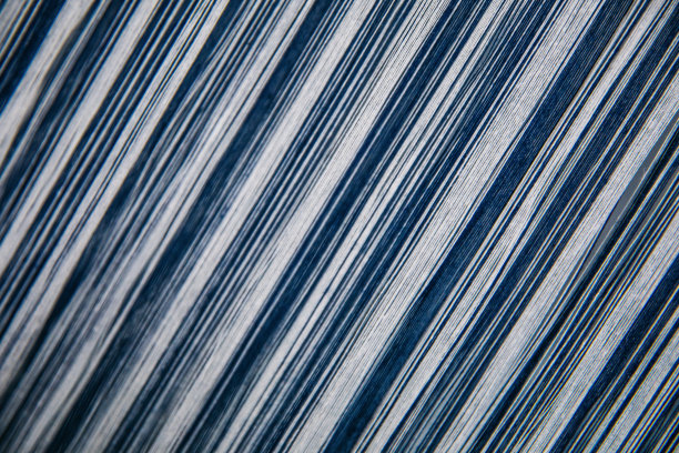 无缝图案织物纹理背景织造纺织机。图片下载