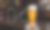生啤酒或精酿啤酒装在高透明玻璃杯中。用冷蒸汽，白色啤酒泡沫放置在木地板上，背景后面是一瓶葡萄酒，威士忌，白兰地在餐厅或酒吧。三维渲染图片下载