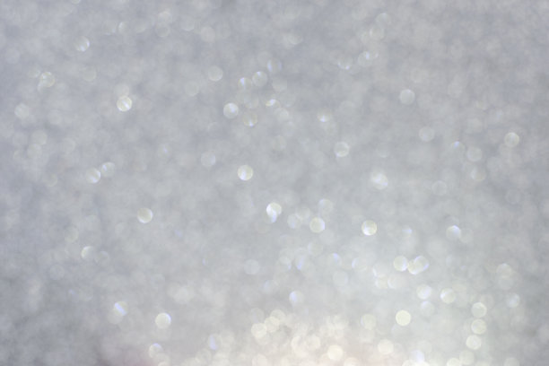 银白色散焦散焦灯。抽象的背景图片下载