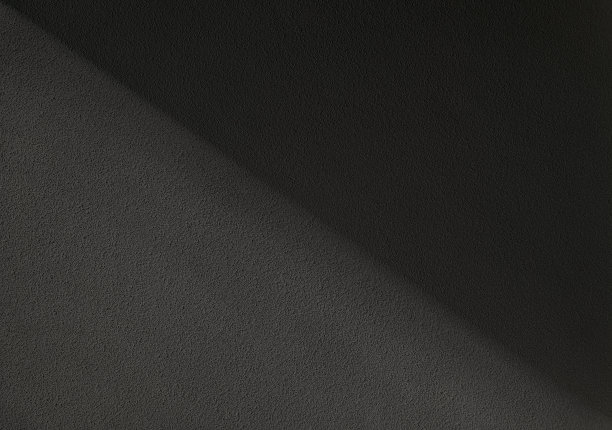 深色粗糙的混凝土墙，带有自然光。抽象墙背景与阴影的自然光在混凝土墙。背景，壁纸，自然阴影图案在墙上。复制空间用于设计。图片下载