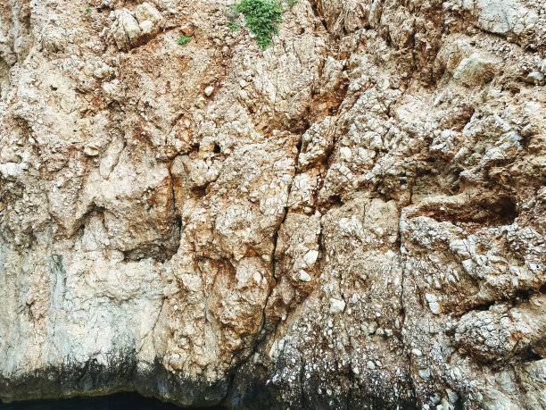 山体纹理，灰色石材具有立体立体结构。背景与天然材料。岩石的沙子和石头，坚实的山岩石图片下载