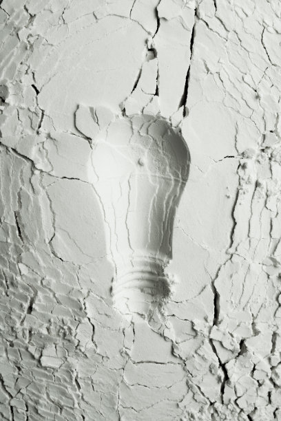 带有灯泡印记的白色抽象背景。图片下载