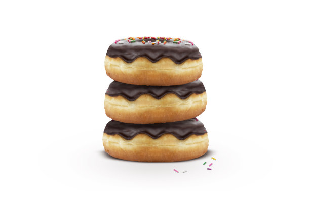 白色背景上洒满彩色糖屑的经典新鲜出炉巧克力甜甜圈图片下载