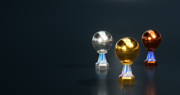 闪亮的排球金银牌和铜牌奖杯与一个深蓝色的背景图片下载