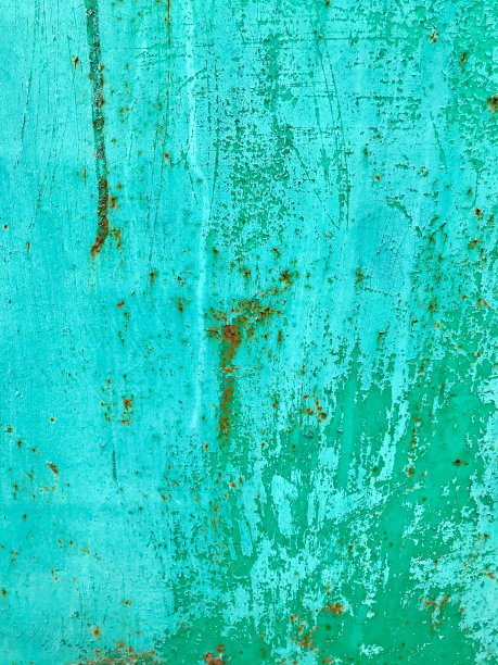 漆成绿松石的金属腐蚀壁。生锈的地方。旧的发票。背景。图片下载
