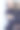 一个穿着深蓝色裙子的金发女人对着镜子图片下载