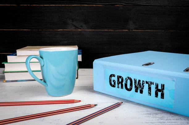 增长。办公桌上的蓝色文件档案图片下载