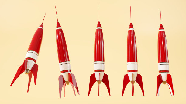 一套红色的发射火箭模型在黄色背景下起飞。图片下载