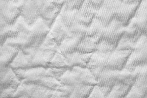 白色塑料尿失禁垫纹理背景的特写。图片下载