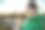 图片兴奋的年轻金发拉丁女人快乐地使用手机在公园背景图片下载