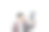 建筑工人手里拿着打孔机，靠在一堵白色的墙上图片下载