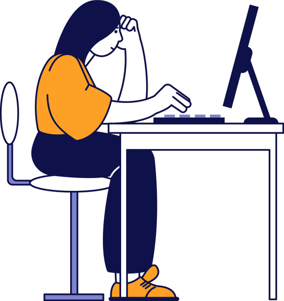 年轻女子坐在电脑桌前工作图片下载