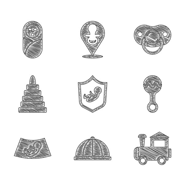 把宝宝放在盾帽玩具火车拨浪鼓上图片下载