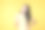 幸福的亚洲女性刷牙的肖像。快乐的亚洲女人穿着黄色t恤站在黄色的背景。图片下载
