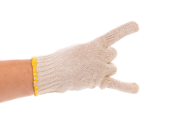 一只戴着针织工作手套的手发出摇滚的手势。图片下载