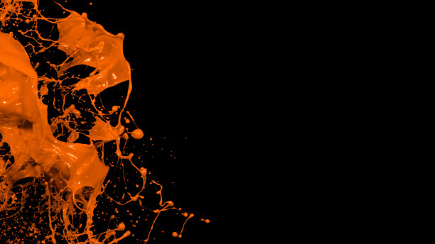 橙色的液体飞溅，漩涡和波浪与分散的水滴图片下载