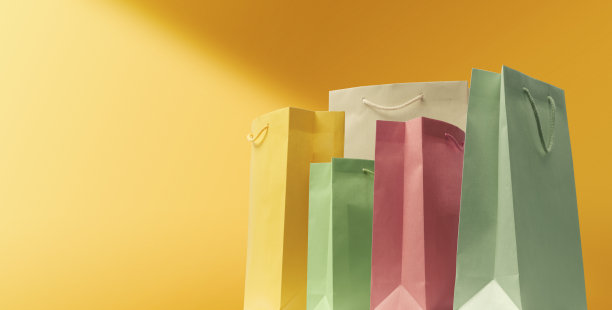 收集黄色背景的购物袋图片下载