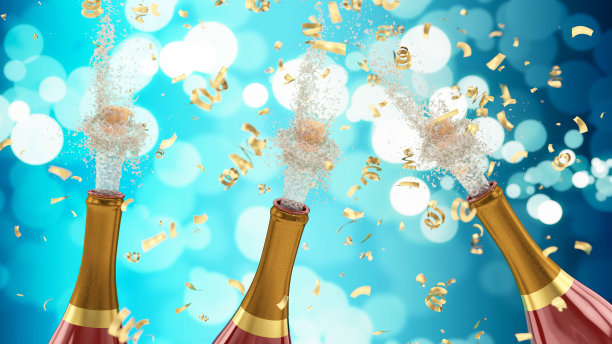 洒有五彩纸屑的香槟瓶图片下载