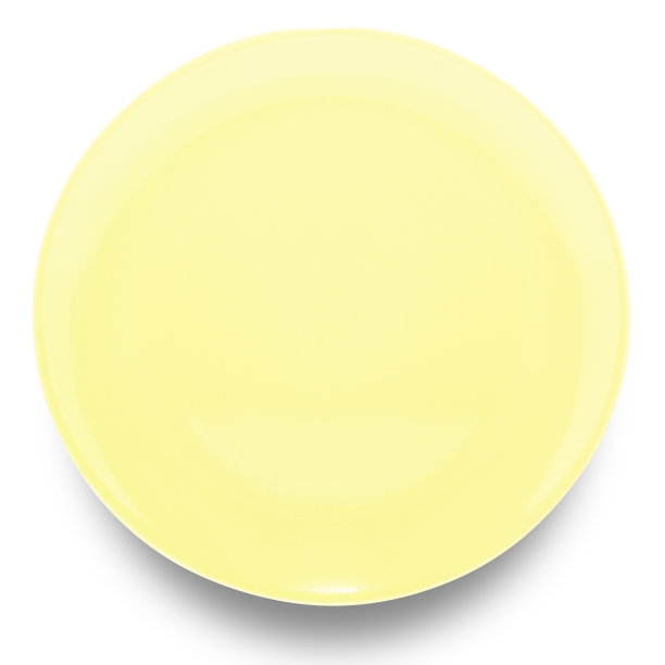 白色背景上孤立的黄色圆形陶瓷板。图片下载