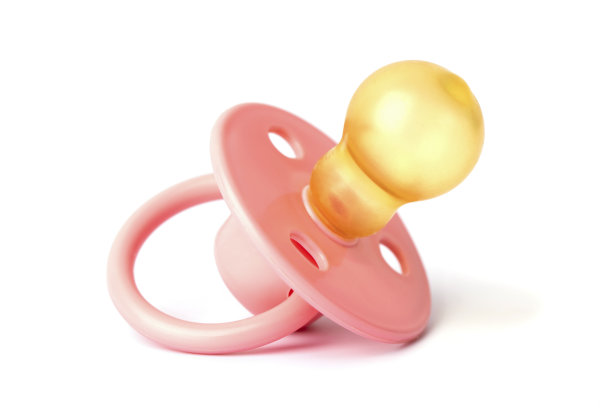 正畸安抚奶嘴孤立于白色。粉红色婴儿奶嘴孤立在白色背景图片下载