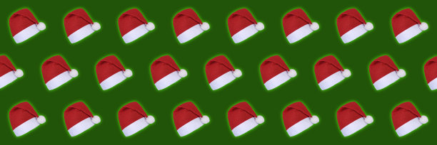 红色圣诞帽孤立在绿色背景圣诞节图片下载