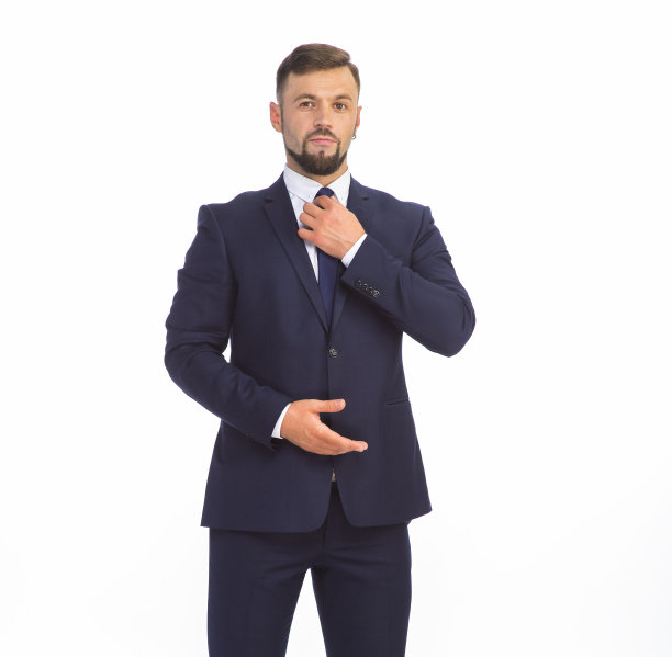 年轻的商人穿着西装，在摄影棚的白色背景上摆出不同的情绪，孤独地成长着图片下载