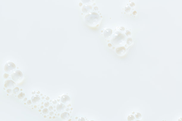 宏观牛奶背景，泡沫在牛奶表面图片下载