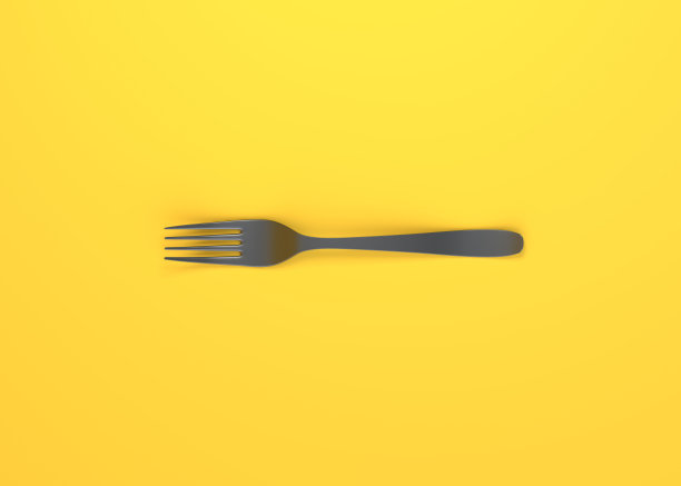 黄色背景上的叉子图片下载