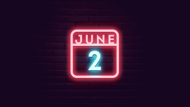 6月2日日历与霓虹蓝色和红色霓虹灯在砖的背景图片下载