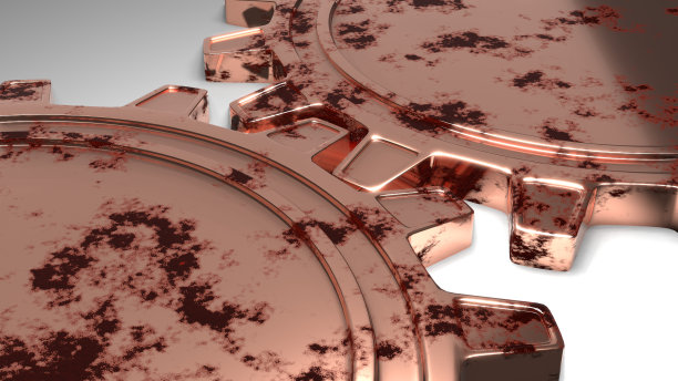 两个金色的金属齿轮转动。图片下载