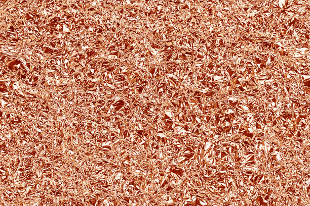 闪亮的铝箔纹理的背景和阴影。折痕。玫瑰金的颜色。红棕色的颜色图片下载