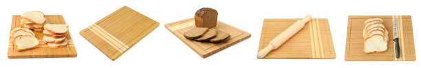 用于在白色背景上切割、擀面棍和切片面包的面包板。全景照片。图片下载