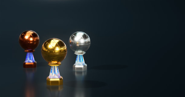 闪亮的排球金牌，银牌和铜牌奖杯集中在金与深蓝色的背景图片下载