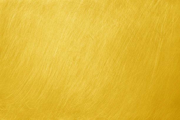 纹理古老的黄色金色铝金属与划痕为背景。图片下载