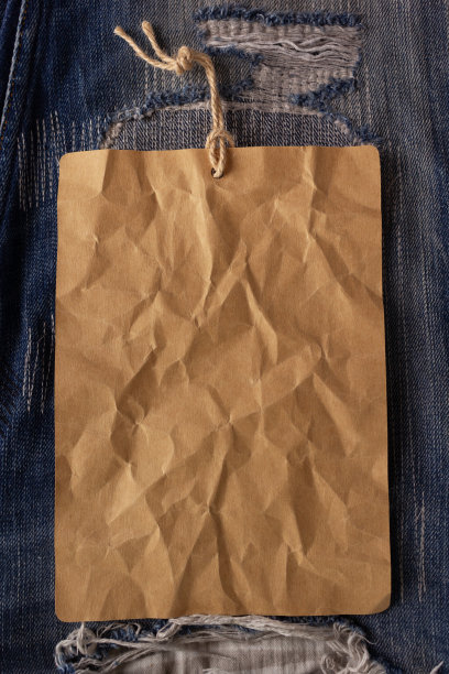 纸张价格标签标签上的牛仔裤背景纹理。蓝色牛仔裤牛仔布图片下载