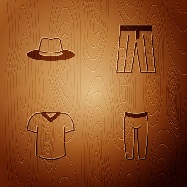 把打底裤、男帽、t恤和裤子放在木头上图片下载