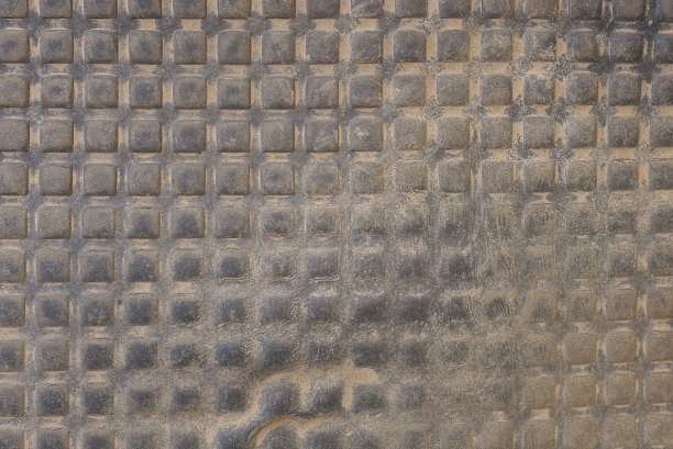 一块旧橡胶地毯上的黑色塑料纹理图片下载